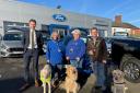 William Hill, director at Hills Ford, Della Campbell with her working guide dog Ufton, Guide Dog volunteer Debbie Pitts with Guide Dog ambassador Luna, and mayor Nick Houghton with Guide Dog ambassador Quiver