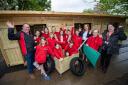 Year six pupils from Crossways Schools celebrate their new outdoor play sheds with staff members Paul Medlicott and Rhian Moore, and Miller Homes sales manager Jemma Phillips
