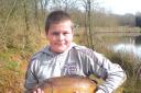 Elgar Technology College student Jordan McCarthy, 13, from Worcester caught this 10-pound carp at a pool near Rushwick.
