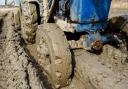 Muddy wheels on a farming vehicle.
