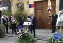 Malcolm Rolfe speaks at the unveiling of a plaque for his father's cousin