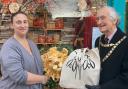Iapetus Gallery joint owner Anna Brook with the shop's winning window display and Malvern mayor Clive Hooper