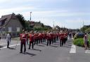 PARADE: Soldiers parade through Arromanches, Normandy.