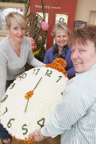 At Parrys of Malvern, Lolly Rudge, Felicity Siviter and Verity Trevor-Morgan create the shop's display. 