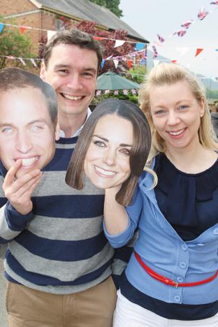 Dafydd and Helen Gibby with their Wills and Kate masks
