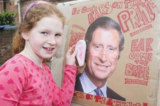Honesty Shaw-Young (8) has a go on Pin the ear on Charles