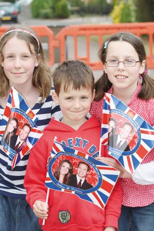 Lauren Hill (12)Thomas Hill (7) and Amy Hill (10) with a William and Kate flags