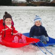 First Sledge Isobel (2) and Thomas Cale (9 mths) on their first sledges