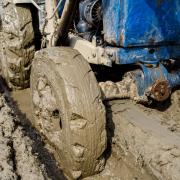 Muddy wheels on a farming vehicle.