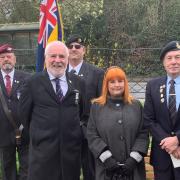 Cllr Martin Allen, Cllr Natalie McVey and veteran Peter Ferroni at the ceremony with two standard bearers