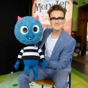 McFly guitarist and the production's author Tom Fletcher pictured with 'Little Monster'