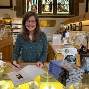 EXPERT: Katherine Little with her book about Malvern Priory