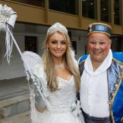 Katie McGlynn and Mark James in costume outside Malvern Theatres