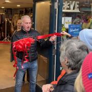 Ian Humphries cuts the ribbon at the new St Richard’s Hospice shop