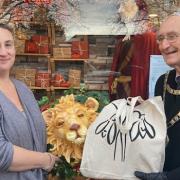 Iapetus Gallery joint owner Anna Brook with the shop's winning window display and Malvern mayor Clive Hooper
