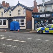 SCENE: The blue forensics tent outside the Beauchamp Arms in Worcester Road, Malvern which has led to an attempted murder arrest as a man fights for his life