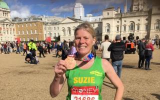 Marathon: Malvern Joggers' Suzie Lane enjoys her moment after completing the London Marathon.