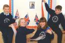 Getting ready for the Golden Jubilee celebrations in April 2002 are Pendock Primary School pupils (from left) Mitchel Dallimore, Lucy Taylor, Amy Bateson and Thomas Whatmore