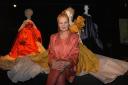 Vivienne Westwood posing with some of her designs in 2004