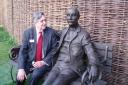 Dr John Harcup with a statue of Sir Edward Elgar