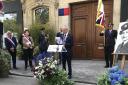 Malcolm Rolfe speaks at the unveiling of a plaque for his father's cousin