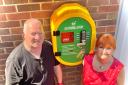 Cllr Natalie McVey, pictured with Nigel Blake of West Malvern Club Ltd, helped fund a new defibrillator