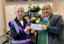 Jill Wytcherley of Friends of Priory Park receives the cheque from Charlotte Allen-Perks of Waitrose