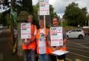 Residents protesting outside Malvern Link Railway Station earlier this year