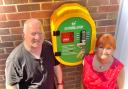 Cllr Natalie McVey, pictured with Nigel Blake of West Malvern Club Ltd, helped fund a new defibrillator