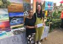 Polly Reehal awards a prize to artist Ruta Rendy