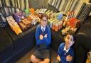 Mia and Charlie with the food they donated to the food bank