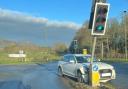 A car was pictured having crashed into traffic lights in Malvern