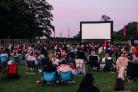 People attending an outdoor cinema event. Credit: Adventure Cinema