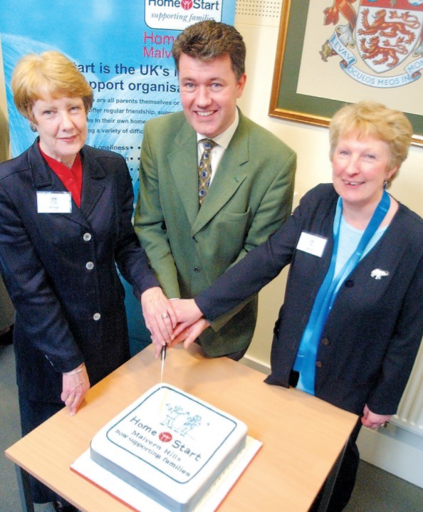 BBC Midlands Today presenter Michael Collie officially opened Home-Start Malvern Hills by cutting a cake in January 2003