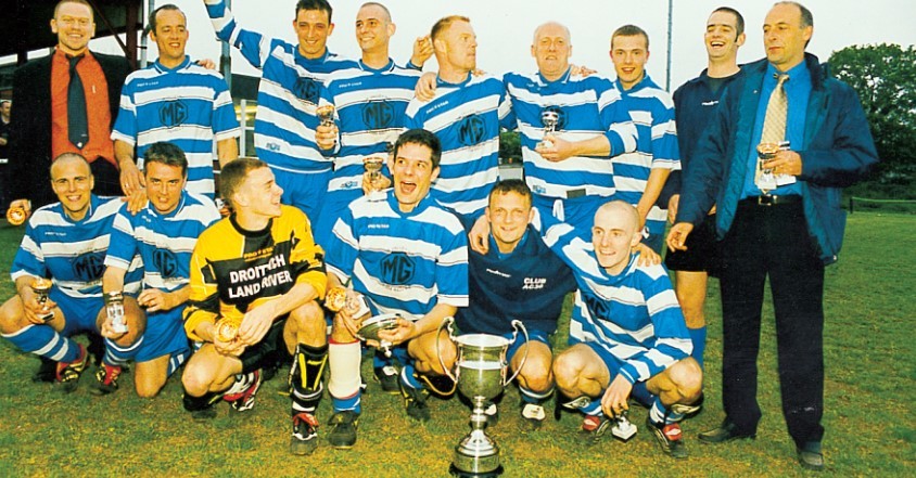 Club AC 30 celebrate their Malvern League Sunday Senior Cup final victory over Kempsey United in 2002