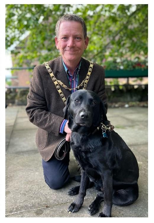Malvern Gazette: HELP: Cllr Nick Houghton with a guide dog