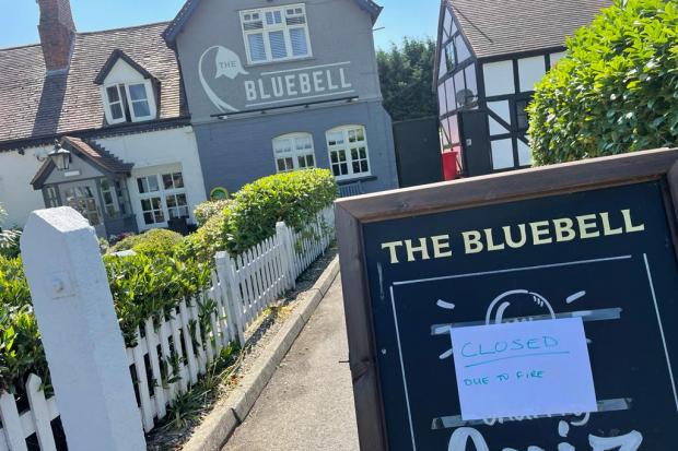 A sign outside The Bluebell Inn says it is closed due to fire