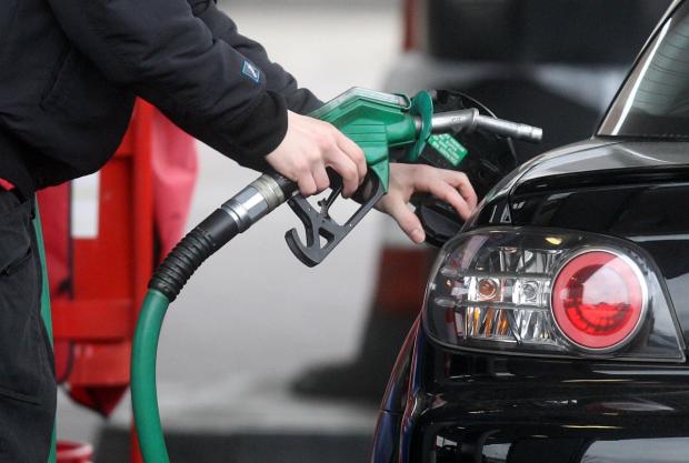 Malvern Gazette: Someone using a fuel pump at a petrol station (PA)