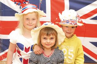 Rebecca Willis, Louise Wills (5) and Willow Haynes (5) with their hads they have decorated