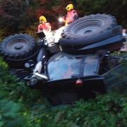 A driver escaped uninjured after their tractor overturned near Bromyard. Picture: Bromyard fire station