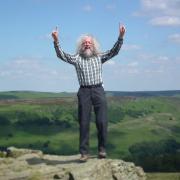 Jeff Kent celebrates the conquest his 500th 1,000ft peak on the summit of Win Hill
