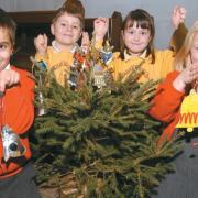Madresfield Primary School and Madresfield Early Years Centre pupils made Christmas tree decorations to raise funds for the restoration of bells at St Mary’s Church in 2004. From left, Andreas Solomou (EYC), Ben Williams (MPS), Harriet Branfield