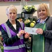 Jill Wytcherley of Friends of Priory Park receives the cheque from Charlotte Allen-Perks of Waitrose