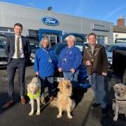 William Hill, director at Hills Ford, Della Campbell with her working guide dog Ufton, Guide Dog volunteer Debbie Pitts with Guide Dog ambassador Luna, and mayor Nick Houghton with Guide Dog ambassador Quiver