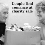 They found love at a charity jumble sale! Organiser Janet Charles with her husband-to-be, Peter Pitt, and a box of goods ready to sell for a good cause.