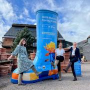 Left to right: Holloways staff Tegan Haley, Verity Manning Cox and Victoria Twinberrow with the RHS Giant Welly outside the showrooms in Suckley.