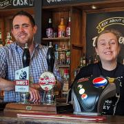 Lewis Daley and Kelly Bennett behind the bar at the New Inn