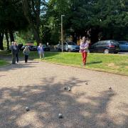 Malvern members of the u3a enjoying a game of petanque outside the Great Malvern train station