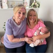 GENERATIONS: Ann Bellamy, 83, her daughter, April Layton-Morris, 60, and the family's new arrival, Daisy Davies, all share the same birthday