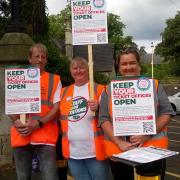 Residents protesting outside Malvern Link Railway Station earlier this year